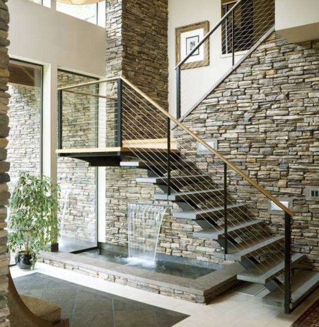 You can have a gorgeous water feature under your stairs for some tranquility