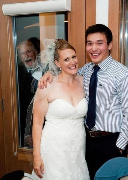 Can't tell if he's photobombing or they are gloating about trapping him in a closet.